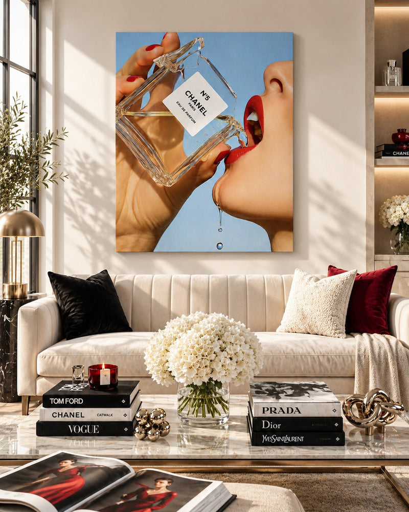 Fashion & Beauty canvas art above a cream sofa in a bright living room