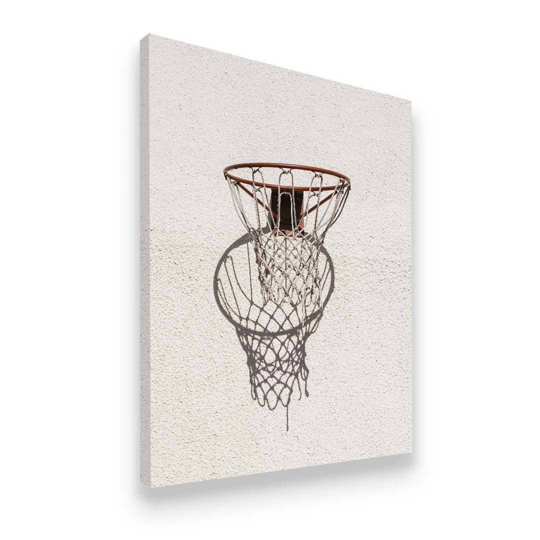 Side-angle view of basketball hoop net shadow canvas print on gallery-wrapped canvas — street court wall art