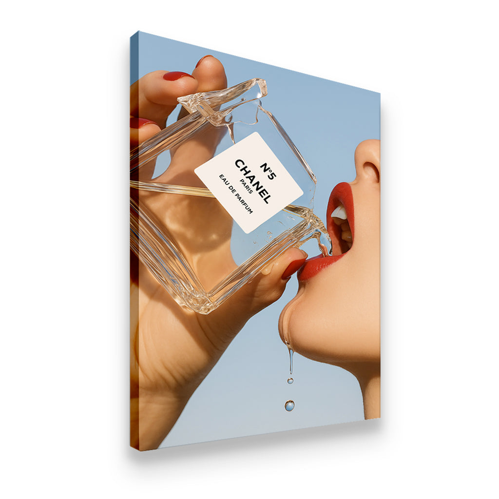 Gallery-wrapped canvas print of Chanel No. 5 bottle with red lips and dripping liquid — luxury fashion wall art