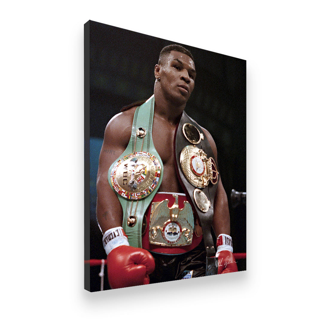 Gallery-wrapped canvas print of Mike Tyson with three heavyweight championship belts, red Everlast gloves, ring background