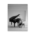 Black and white canvas wall art of a hooded pianist playing a grand piano in a minimal white room