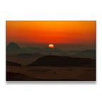Desert sunset canvas wall art with silhouetted rock formations and fiery orange sky at dusk