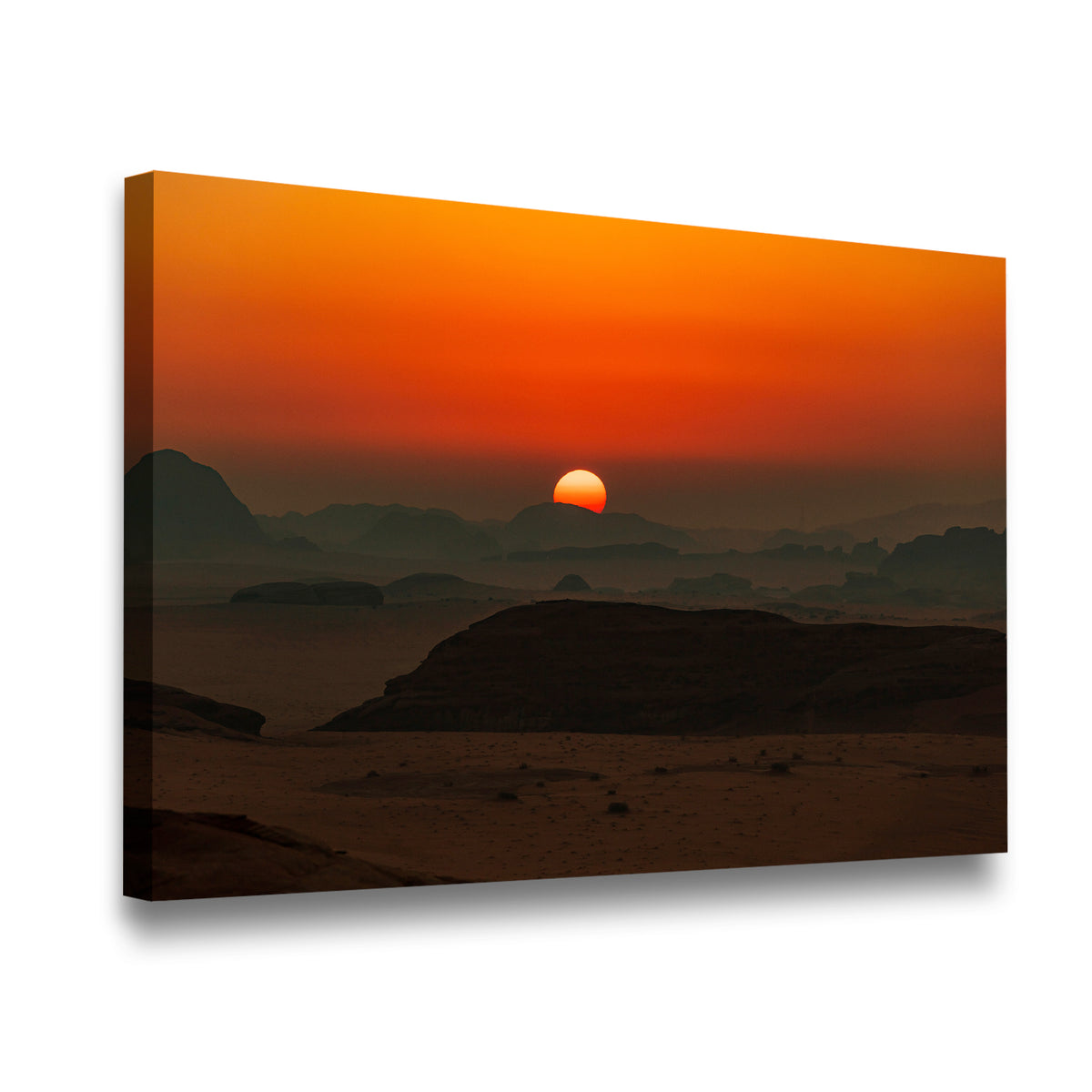 Gallery-wrapped desert landscape canvas wall art showing glowing amber sun setting over misty desert ridgelines