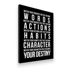 Angled view of bold typographic motivational canvas wall art with white text on black background — Canvas District