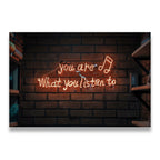 You Are What You Listen To amber neon sign on brick wall canvas wall art — music quote decor