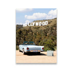 Pale blue classic convertible with DREAMER license plate parked below the Hollywood Sign on a sunny LA hillside — canvas wall art
