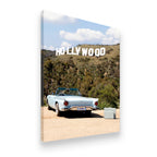 Gallery-wrapped canvas of a vintage Thunderbird-style roadster facing the Hollywood Sign on a dusty California road