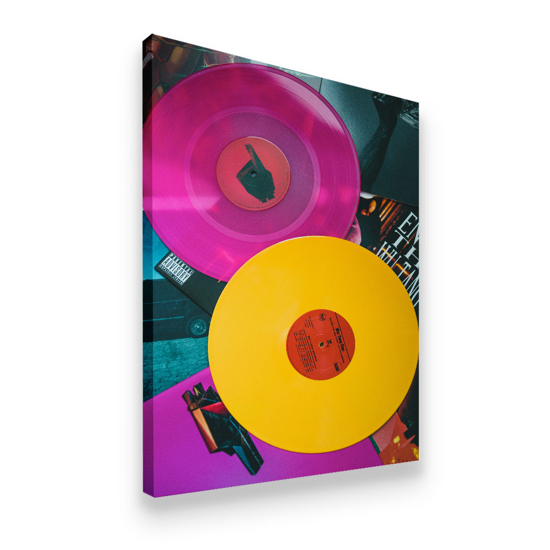 Gallery-wrapped canvas wall art of Wu-Tang Clan colored vinyl records in magenta and yellow with hip-hop album covers