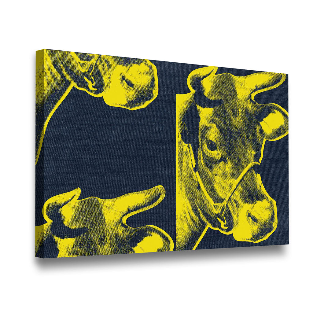 Side-angle view of yellow and navy pop art cow canvas wall art showing gallery-wrapped depth and texture