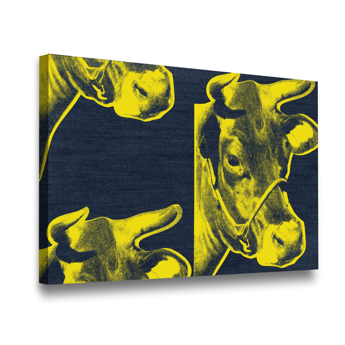 Side-angle view of yellow and navy pop art cow canvas wall art showing gallery-wrapped depth and texture