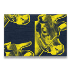 Pop art cow canvas wall art with bold yellow cow portraits on a dark navy blue background, screen-print style