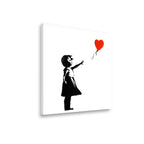 Angled view of girl with red heart balloon canvas wall art showing gallery wrap depth and print quality