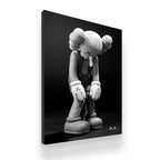 KAWS Companion brooding sculpture black and white gallery-wrapped canvas wall art side angle view