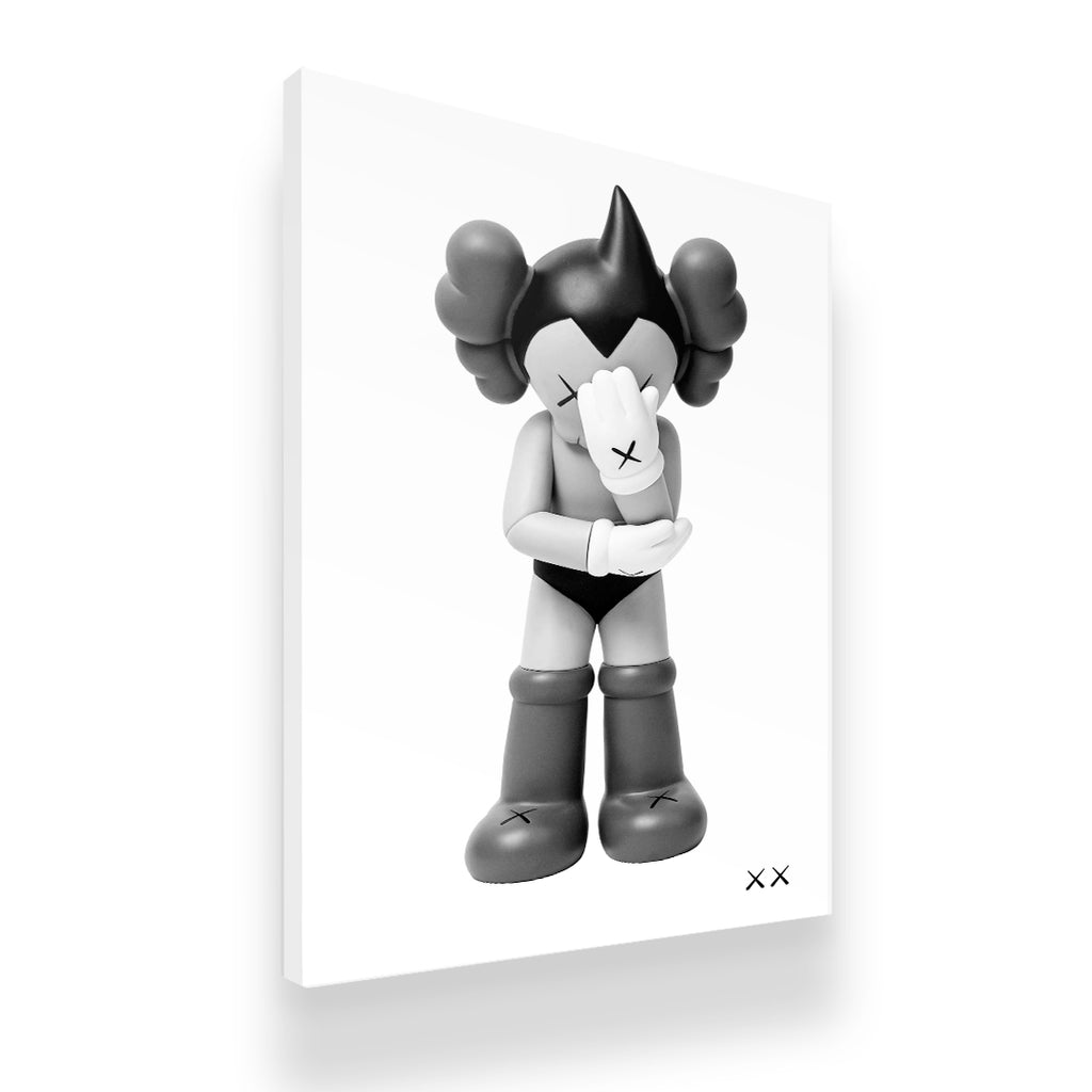 Gallery-wrapped KAWS Astro Boy inspired monochrome canvas print, side angle showing depth and archival print quality