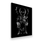Gallery-wrapped canvas of KAWS Companion in spiked armor with butterfly details, side-angle view showing depth and print qua