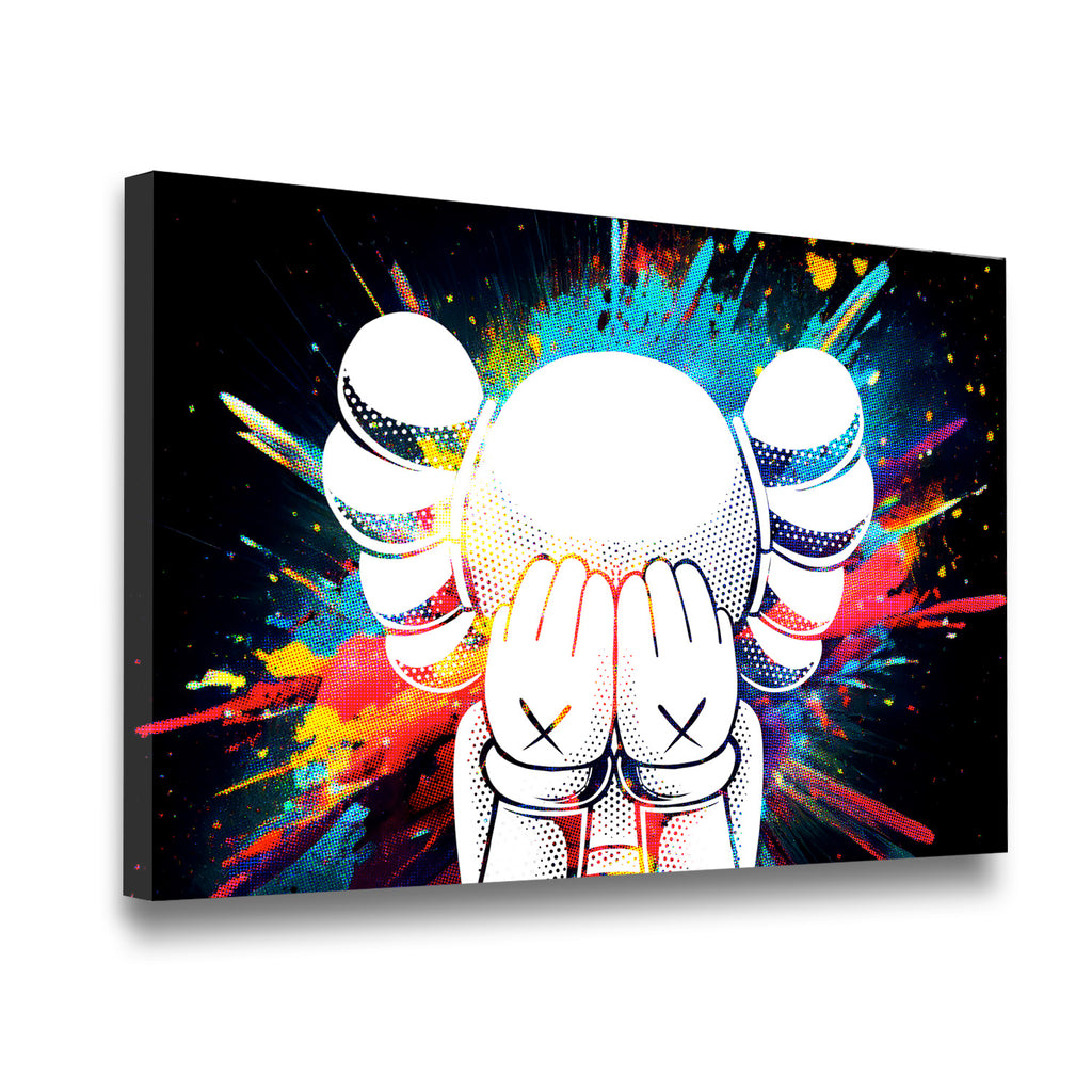 Gallery-wrapped KAWS-inspired pop art canvas showing cross-eyed figure with vibrant rainbow paint splatter