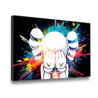 Gallery-wrapped KAWS-inspired pop art canvas showing cross-eyed figure with vibrant rainbow paint splatter