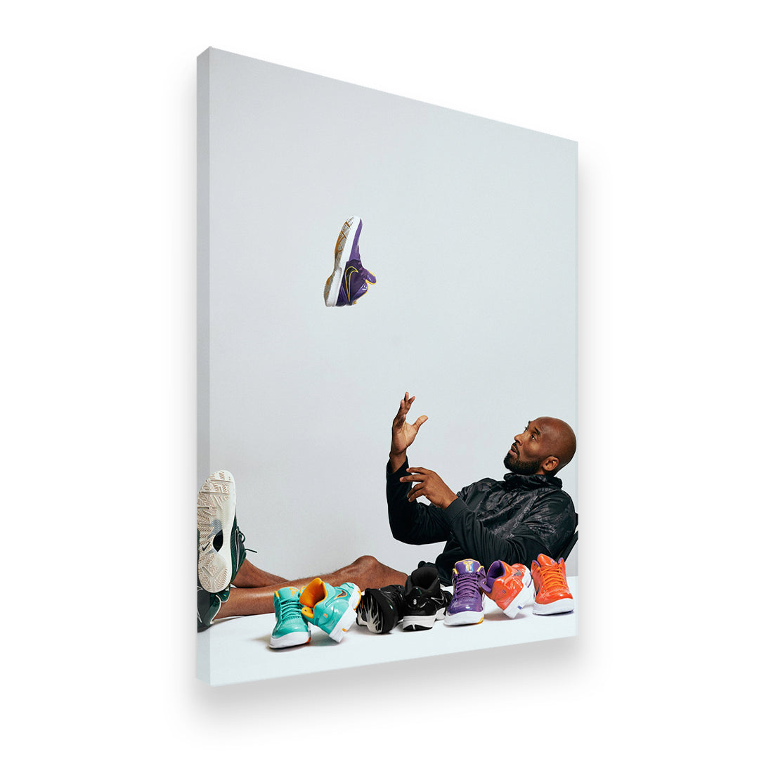 Gallery-wrapped canvas print of Kobe Bryant tossing a sneaker surrounded by his iconic Nike Kobe shoe lineup