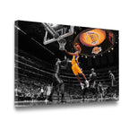 Gallery-wrapped Kobe Bryant Lakers layup canvas wall art shown at an angle, selective color gold uniform against monochrome 
