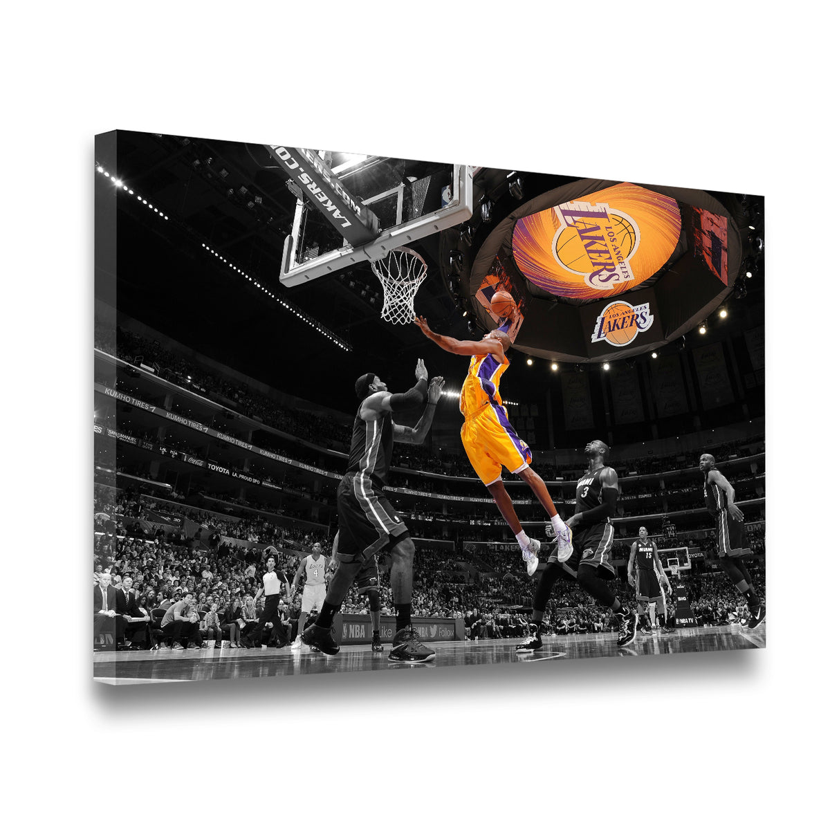 Gallery-wrapped Kobe Bryant Lakers layup canvas wall art shown at an angle, selective color gold uniform against monochrome 
