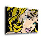 Gallery-wrapped pop art canvas wall art showing a comic girl portrait with bold yellow hair and halftone detail, angled side