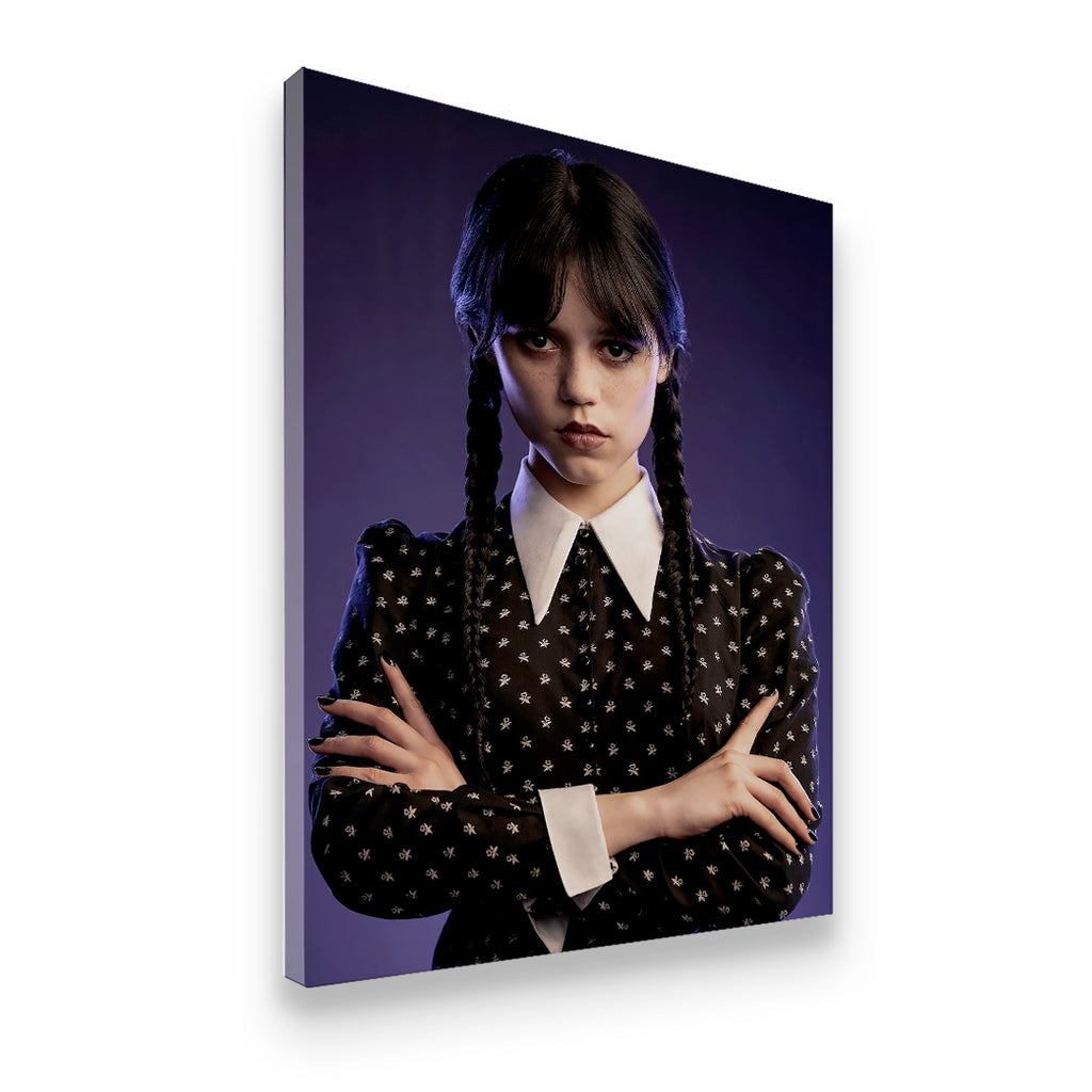 Gallery-wrapped Wednesday Addams canvas wall art shown at angle, dark purple background with skull-print dress and crossed a